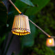 Elevate Outdoor Spaces: The Okinawa Garland, Featuring Handcrafted Bamboo Lampshades for Nature-Inspired Lighting.
