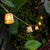 Okinawa Garland: Bamboo Crafted Bell-Shaped Lampshades Illuminate Gardens with Organic Elegance and Charm.